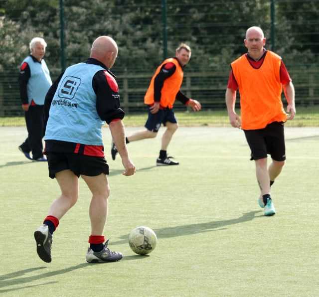 Football players in a field.