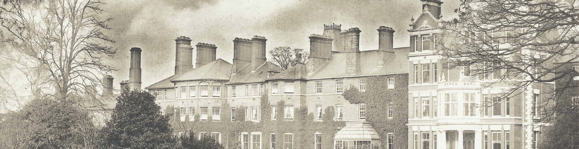 A black and white picture of a houses on a street.