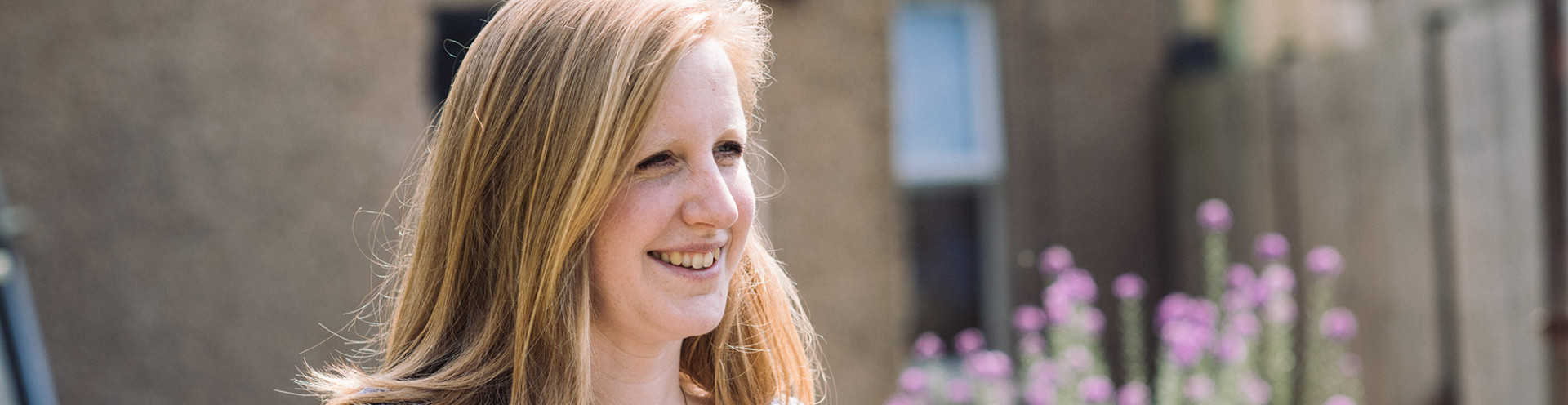 Team member Hannah sitting in a community space.
