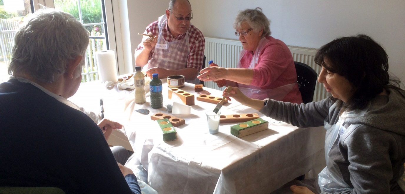 Manor Gardens Woodwork Group working together.
