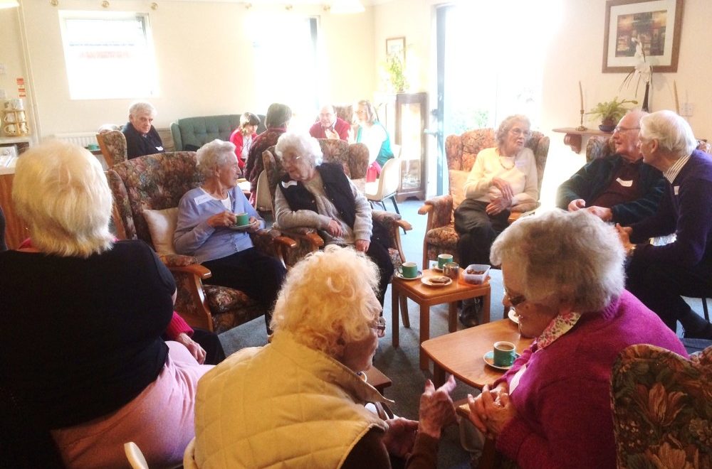 Elderly community members socialising.