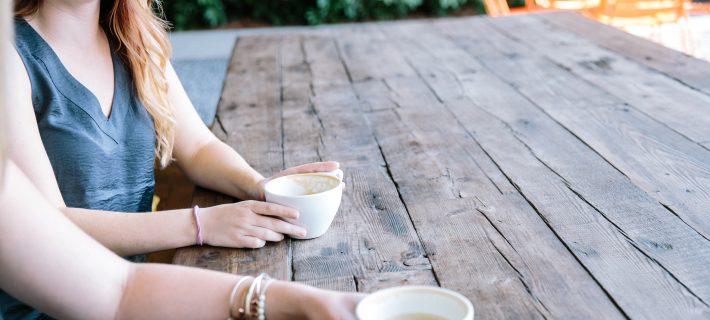 Community members holding coffee cups.