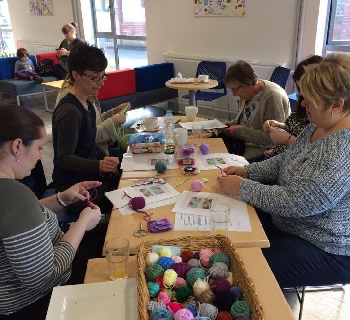 A craft group working together.