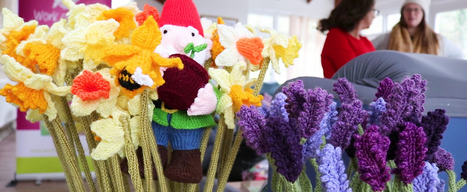 Knitted gnome and flowers
