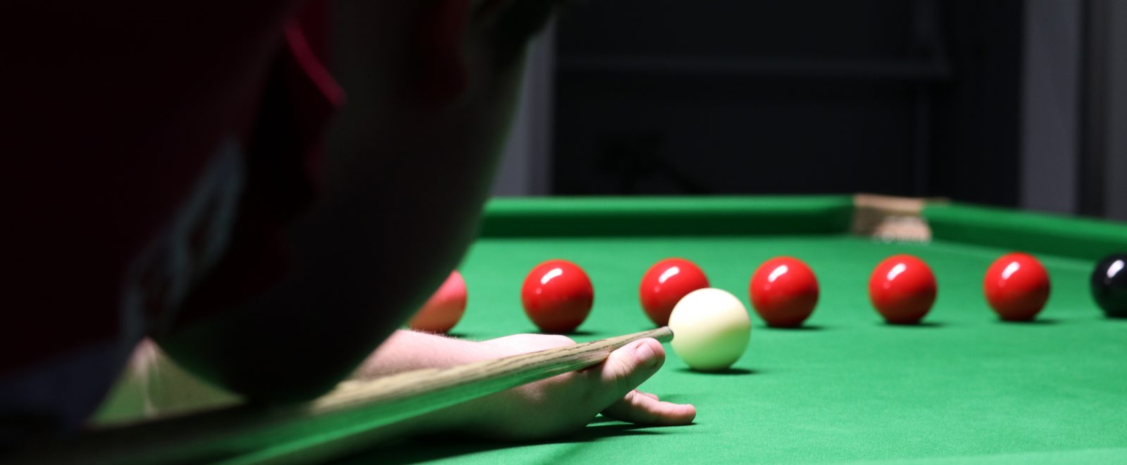 Aaron taking a snooker shot