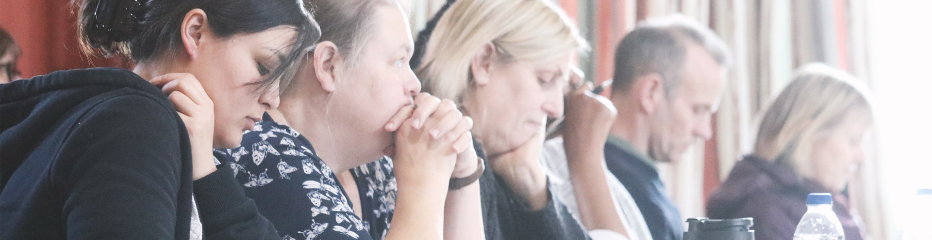 Attendees listening a community workshop