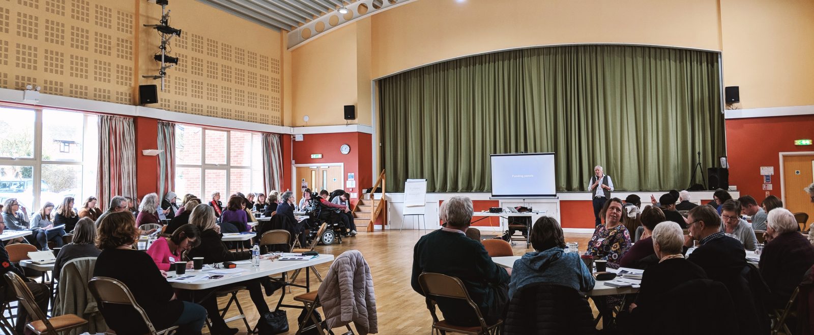 Meeting room full of attendees on the event day