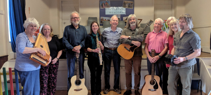 A community group together for a local music event.