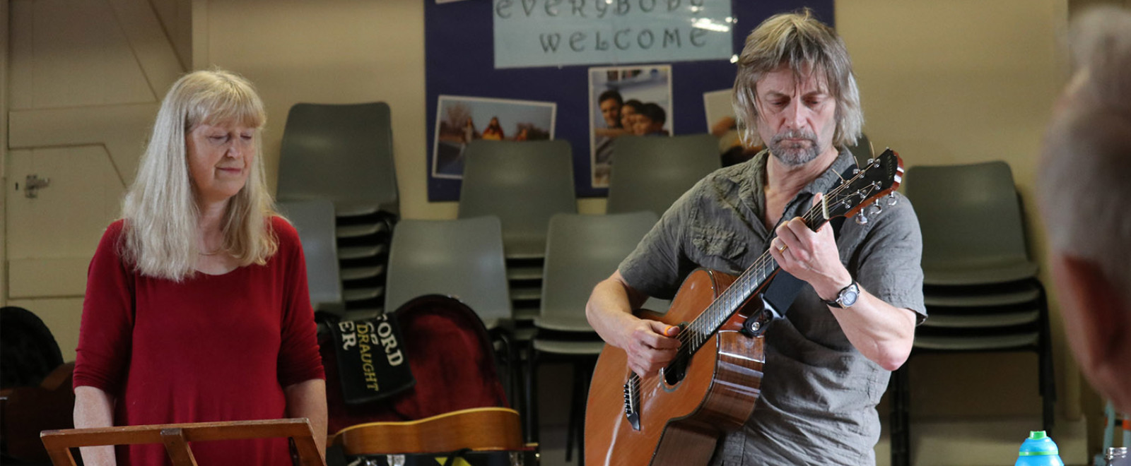 Performers singing together at the daylight acoustic club.
