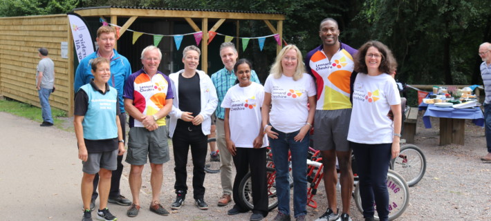 A group of people having a nice time together one the opening day of the cycling project.