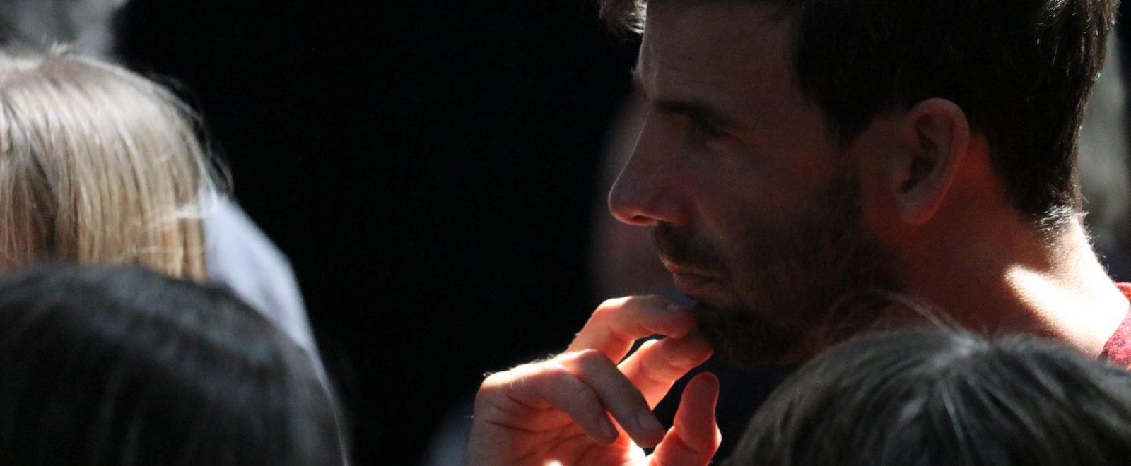 Man listening a speech in participatory community building event