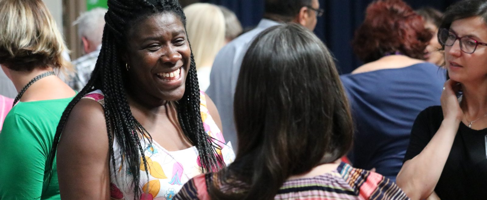 Community members socialising in the participatory community building event