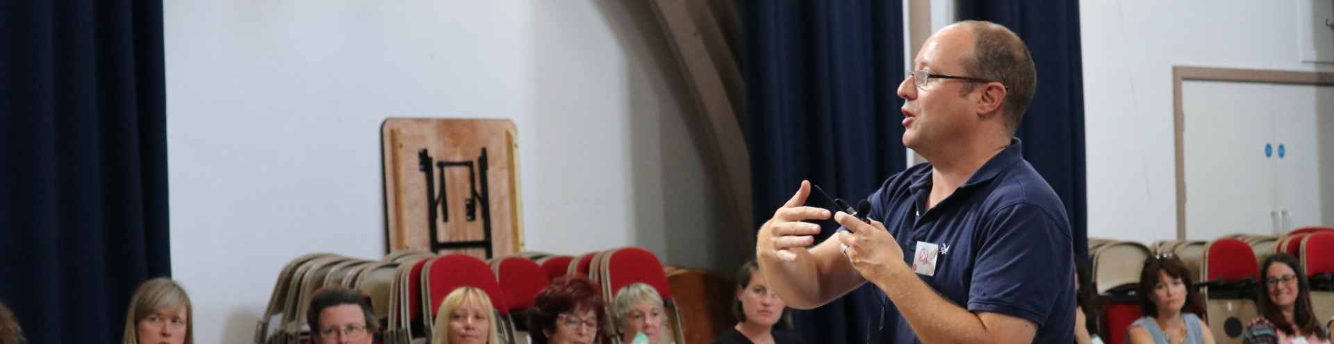 Man giving a speech at The Art of Participatory Community Building event