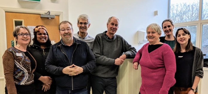 Smiling community group members having a workshop about communications