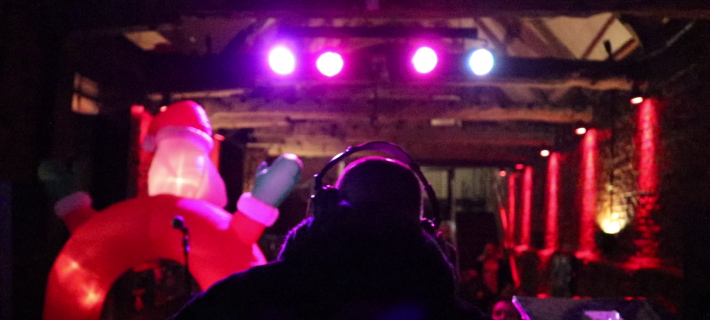 Dj playing music in a music event for the community