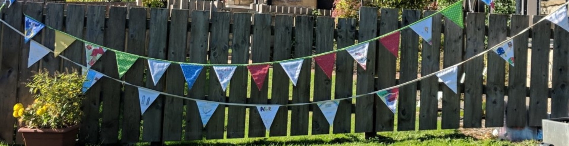 Beautiful bunting flags showcasing outside after community bunting project