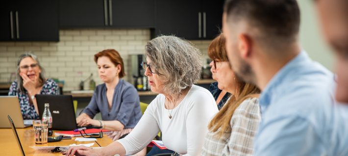 Photo of Barnwood Trust staff in a meeting