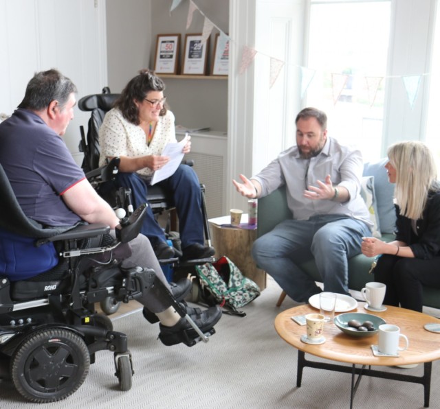 Photo of Barnwood Circle members and Anna Peacock, discussing their experiences at the individual grants launch