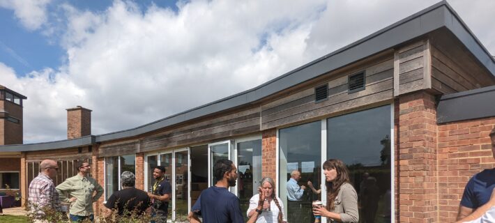 Photo of a people enjoying the garden outside the Garden Room at WWT Slimbridge Wetland Centre