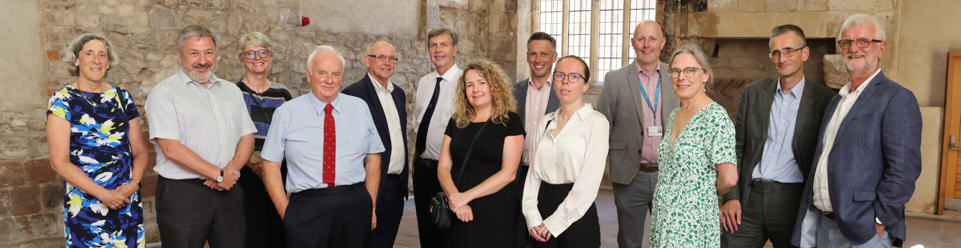 Photo of representatives from Barnwood Trust and Stonewater at an event to celebrate the completion of the sale of Manor Gardens