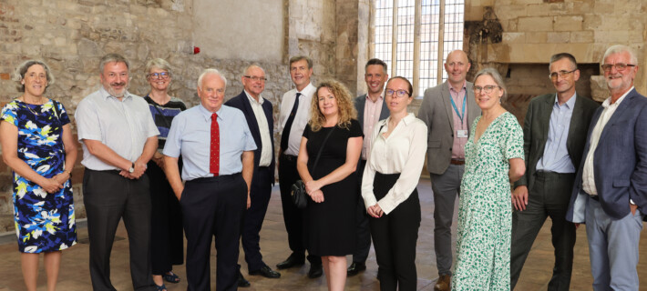 Photo of representatives from Barnwood Trust and Stonewater at an event to celebrate the completion of the sale of Manor Gardens