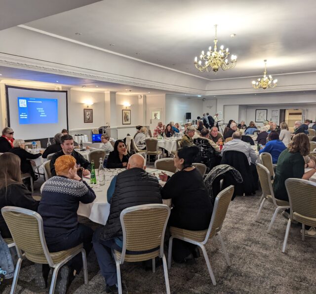 Photo of a room at Hatherley Manor Hotel showing attendees at Together with Barnwood 2023.