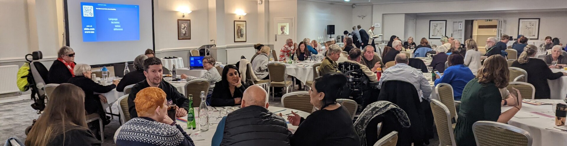 Photo of a room at Hatherley Manor Hotel showing attendees at Together with Barnwood 2023.