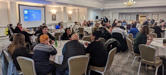 Photo of a room at Hatherley Manor Hotel showing attendees at Together with Barnwood 2023.