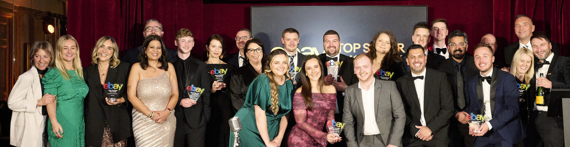 The team at Sofab Sports on stage at the 2025 Ebay awards holding an Ebay award