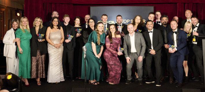 The team at Sofab Sports on stage at the 2025 Ebay awards holding an Ebay award